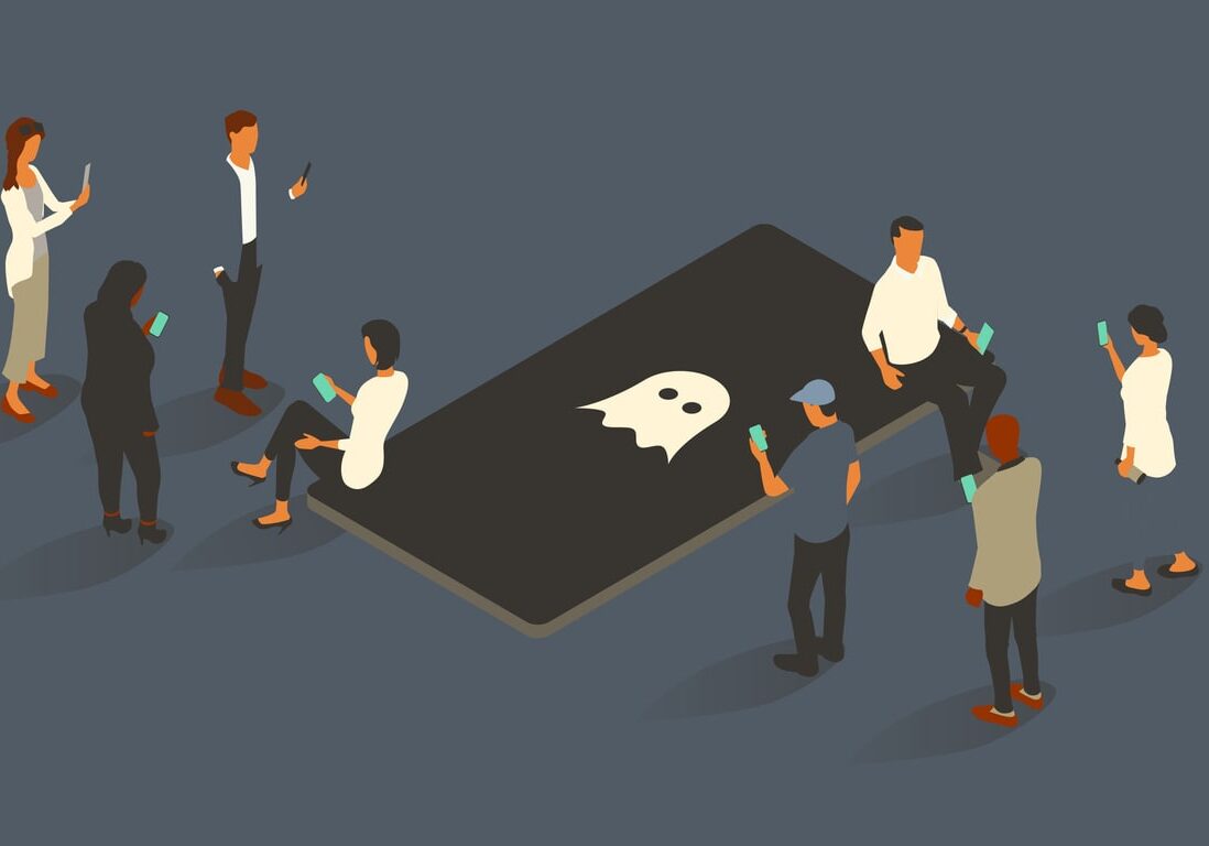 people surround an oversized phone with a ghost icon on-screen